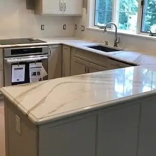 Light stone kitchen countertop with soft gray veining.