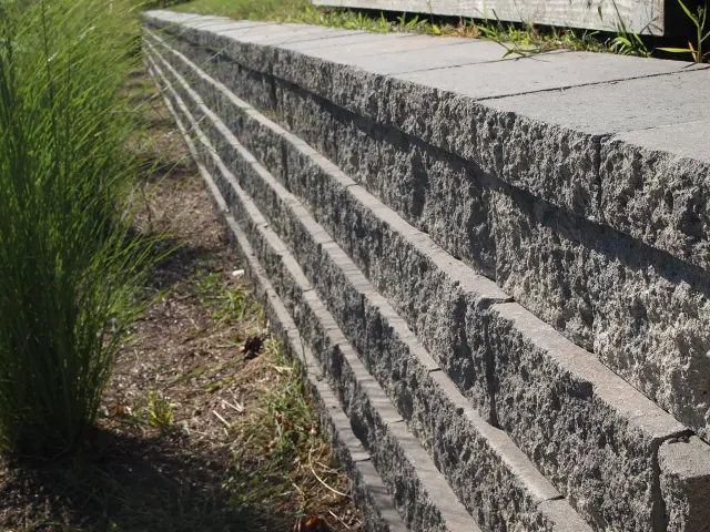 Stone front steps at a completed home exterior.