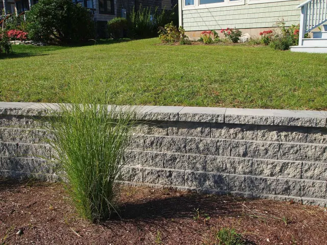 Curved stone entry step at a home.