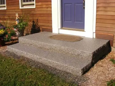 Stone retaining wall in a residential landscape.