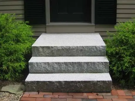 Stone and concrete steps at a residential entry.