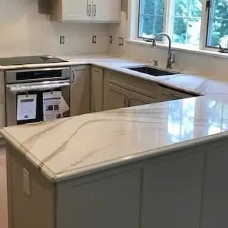 Light stone kitchen countertop with soft gray veining.